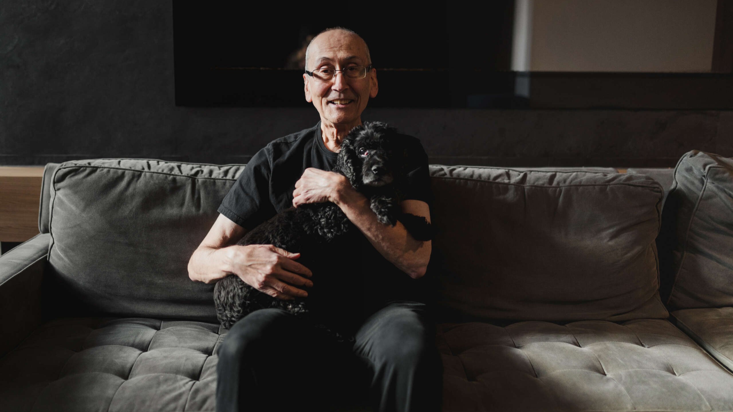 Stevan Harnad holding his dog in arms